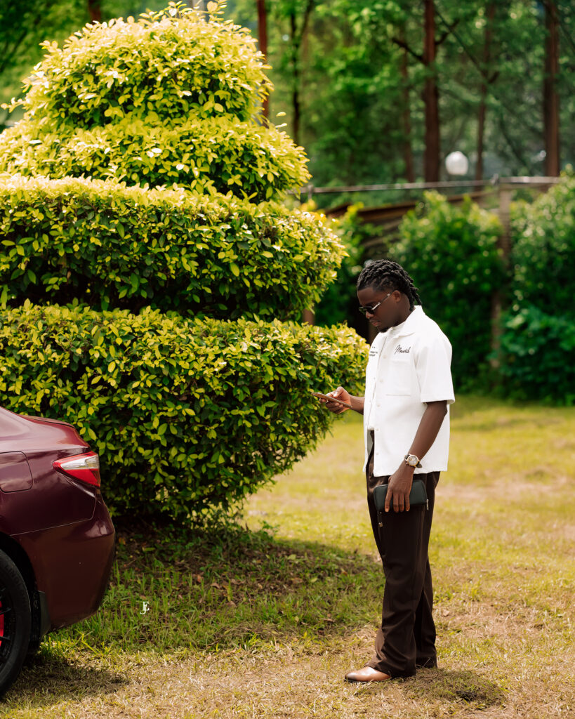 Iniubong Jeremiah working from his phone
